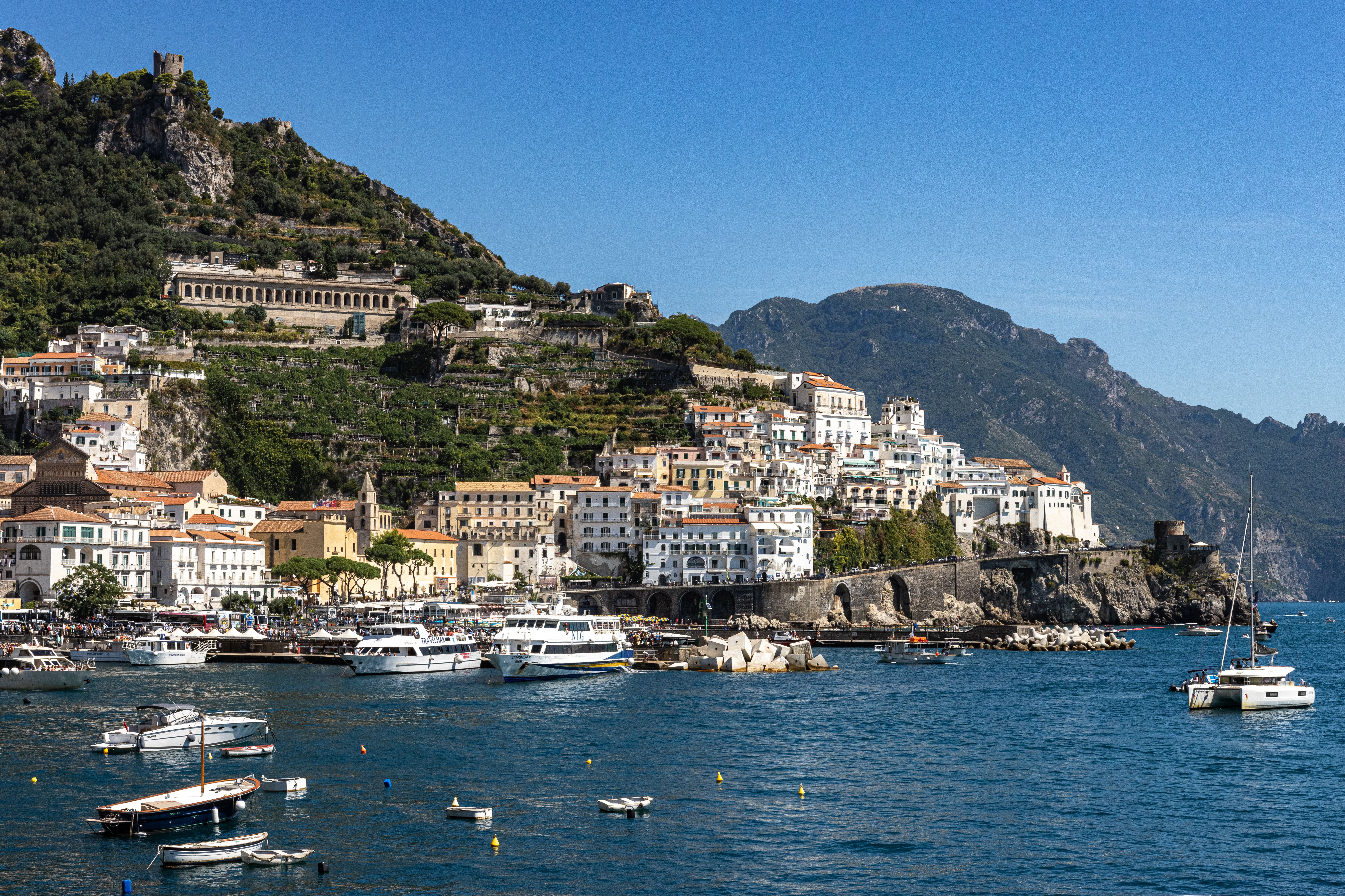 Amalfi coastal town and marina in Italy along the Mediterranean shoreline